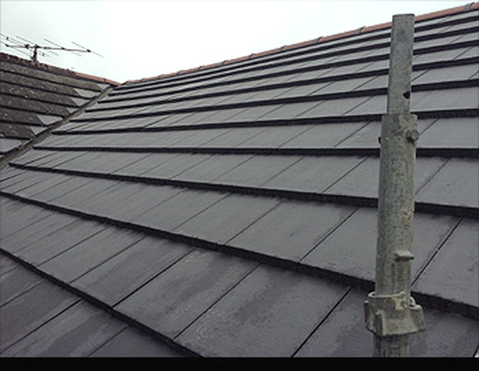 Slate roof detail with stepped courses and leadwork